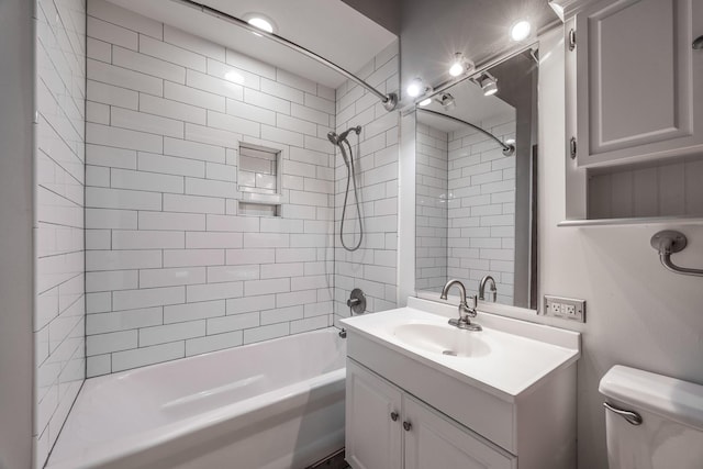 full bath featuring shower / washtub combination, vanity, and toilet