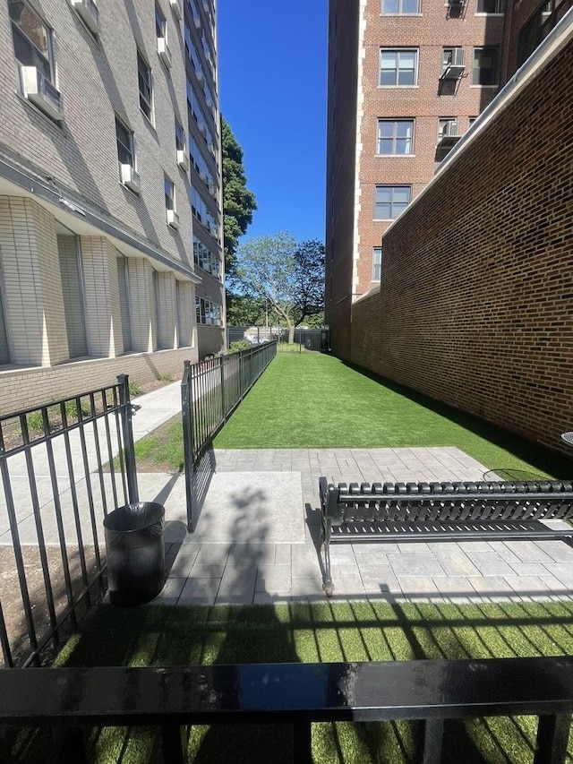 view of yard with fence and cooling unit