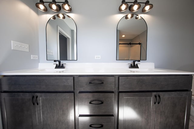 bathroom with double vanity and a sink