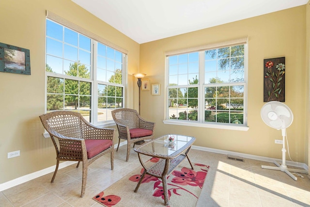 sitting room featuring visible vents, baseboards, and tile patterned floors