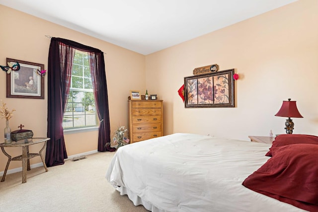 bedroom featuring carpet, visible vents, and baseboards