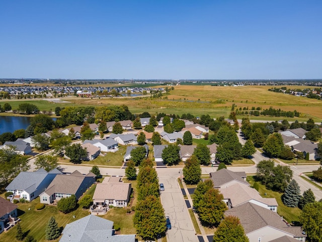 aerial view with a residential view and a water view