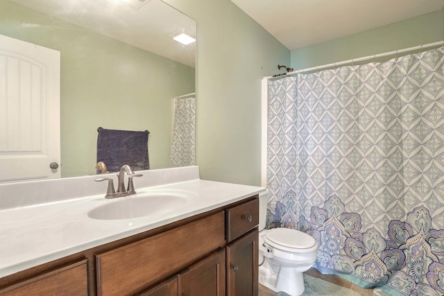 full bath featuring curtained shower, vanity, and toilet