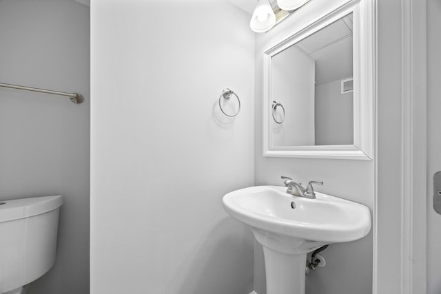 bathroom featuring visible vents and toilet