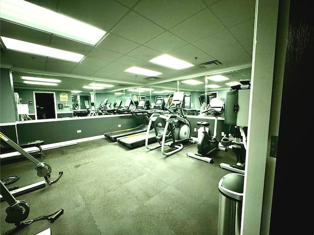 exercise room featuring a drop ceiling and visible vents