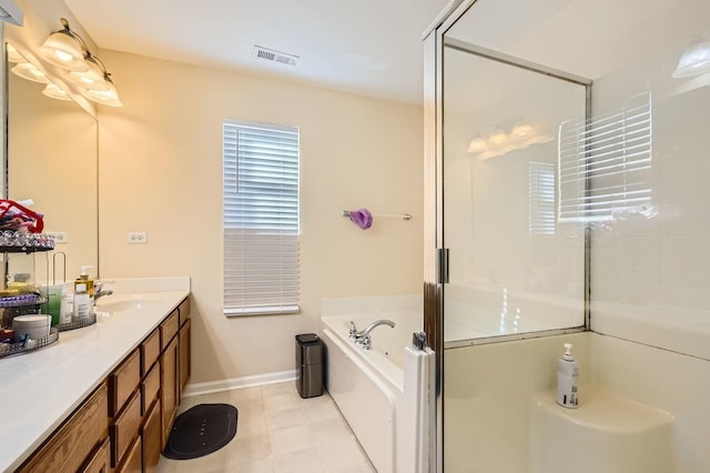 bathroom with visible vents, a stall shower, vanity, tile patterned flooring, and a bath