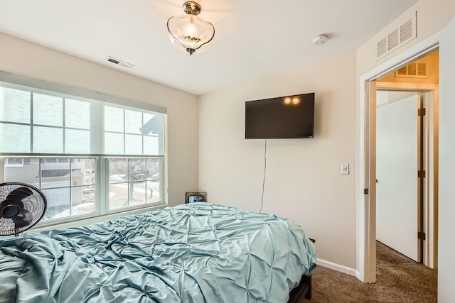 bedroom featuring carpet floors, baseboards, and visible vents