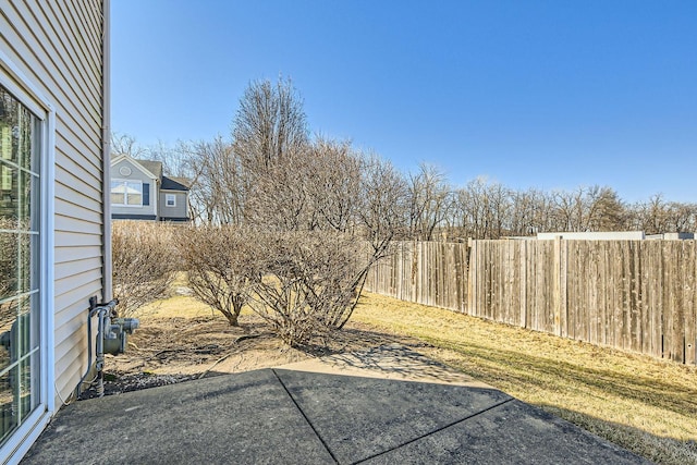 view of yard with a patio and fence