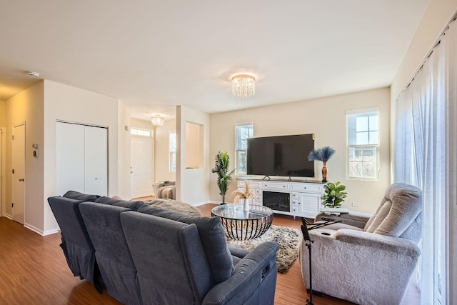 living area featuring wood finished floors and baseboards