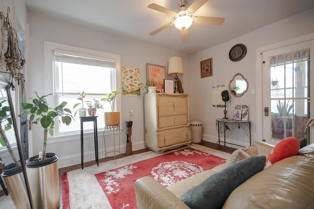 7940 S Oglesby Ave, Chicago, IL 60617 - living area with healthy amount of natural light, a ceiling fan, baseboards, and wood finished floors