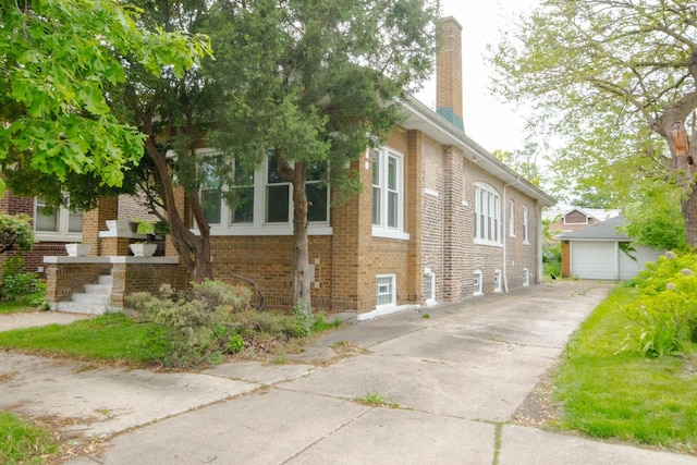 7940 S Oglesby Ave, Chicago, IL 60617 - view of property exterior with brick siding and a chimney
