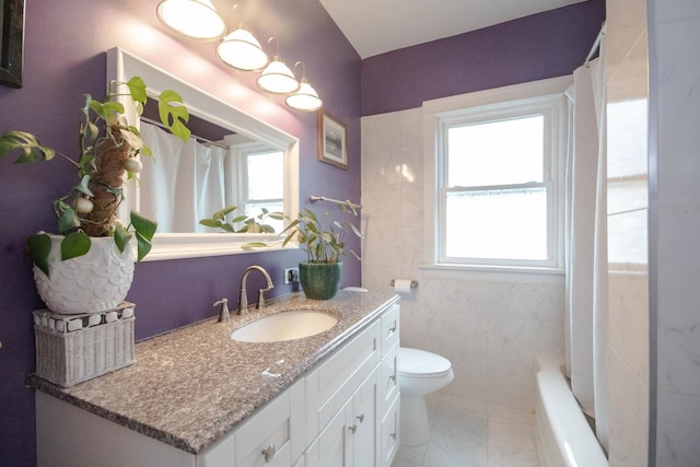 7940 S Oglesby Ave, Chicago, IL 60617 - full bathroom with toilet, vanity, marble finish flooring, and tile walls