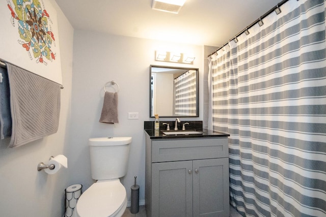 7940 S Oglesby Ave, Chicago, IL 60617 - bathroom with vanity, toilet, and a shower with curtain