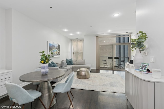 dining area featuring recessed lighting, wood finished floors, and baseboards