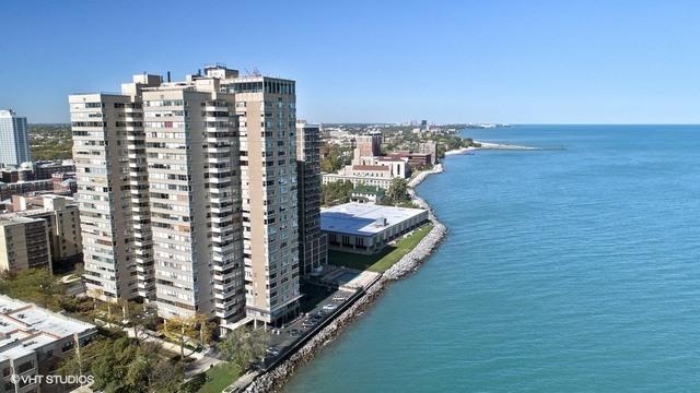 aerial view with a water view and a city view