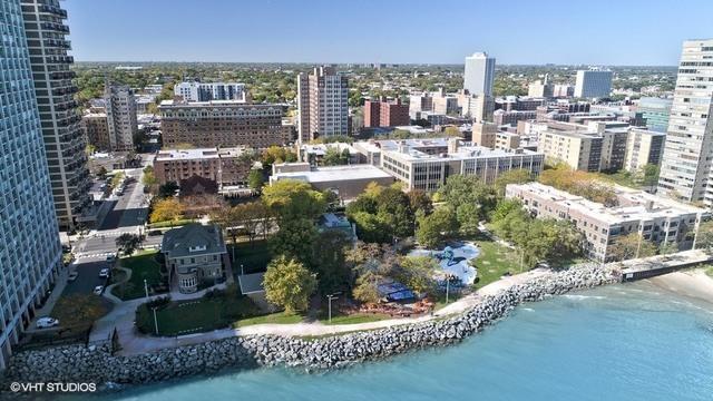 aerial view featuring a view of city and a water view