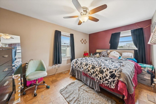 9 Forest Ln, Elk Grove Village, IL 60007 - bedroom with visible vents, multiple windows, and a ceiling fan