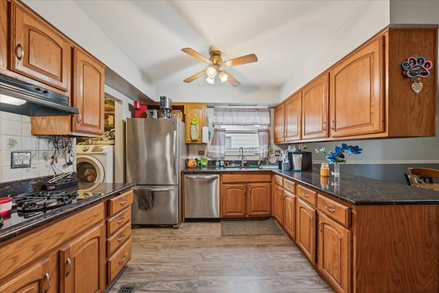 9 Forest Ln, Elk Grove Village, IL 60007 - kitchen with ceiling fan, under cabinet range hood, brown cabinets, stainless steel appliances, and washer / dryer