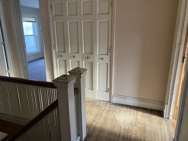 hall with wood finished floors