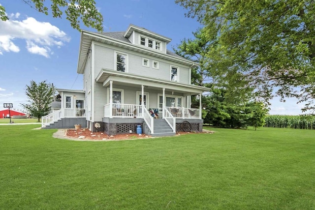 traditional style home with covered porch and a front yard