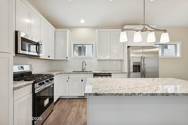 5912 Prairie Ridge Rd, Crystal Lake, IL 60014 - kitchen with appliances with stainless steel finishes, backsplash, white cabinets, and recessed lighting