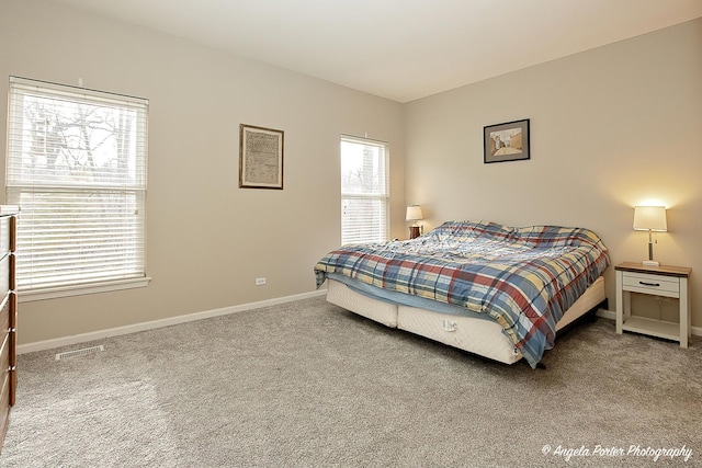 bedroom featuring carpet floors, baseboards, and visible vents