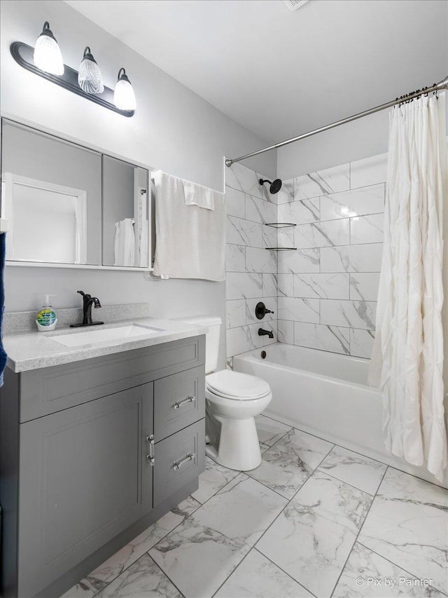 full bath with marble finish floor, vanity, shower / tub combo, and toilet