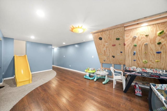 game room with baseboards, wood finished floors, and recessed lighting