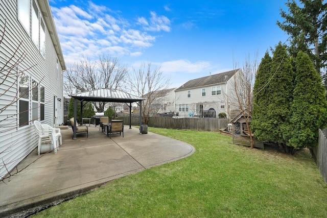 view of yard featuring a fenced backyard, a gazebo, and a patio area