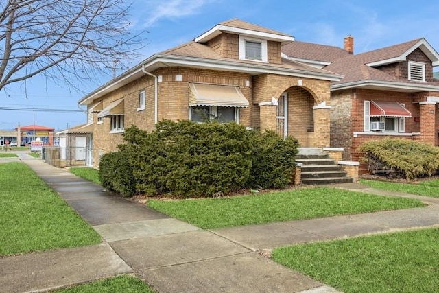 view of front facade featuring a shingled roof, cooling unit, and brick siding