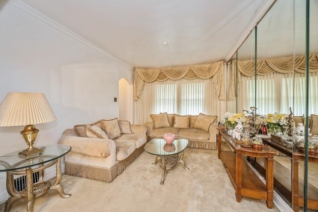 living room featuring arched walkways, carpet, and crown molding