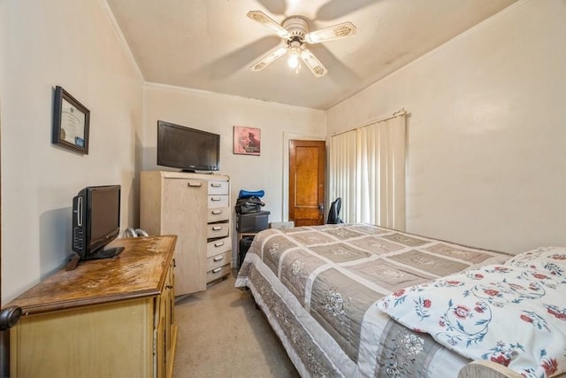 bedroom featuring a ceiling fan and light colored carpet