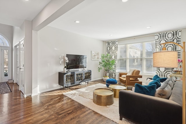 living area featuring recessed lighting, baseboards, and wood finished floors