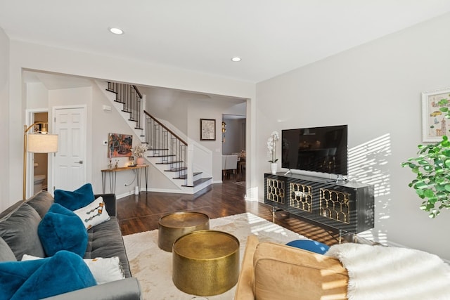 living area featuring recessed lighting, stairway, baseboards, and wood finished floors