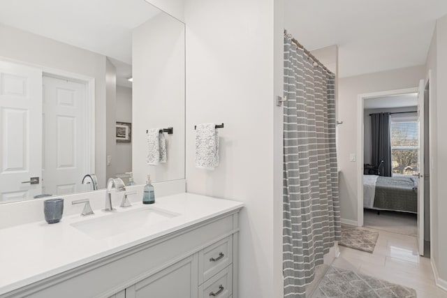 ensuite bathroom with tile patterned flooring, ensuite bath, vanity, and a shower with shower curtain