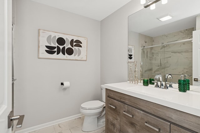 bathroom featuring a marble finish shower, baseboards, toilet, marble finish floor, and vanity