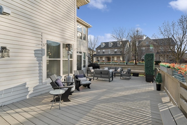 deck featuring a residential view and an outdoor living space