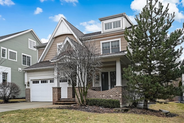 view of front of house with a garage, brick siding, and driveway