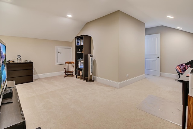 interior space with recessed lighting, baseboards, carpet, and vaulted ceiling