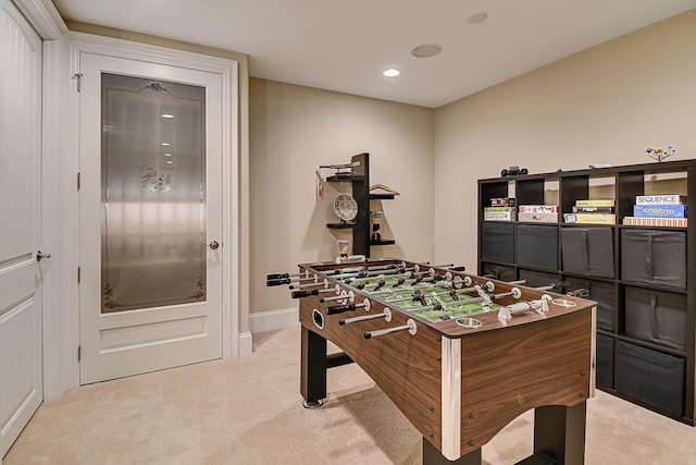 game room with recessed lighting, baseboards, and light carpet