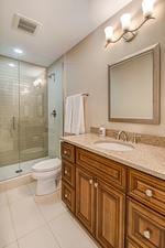 full bath with vanity, visible vents, a shower stall, tile patterned floors, and toilet