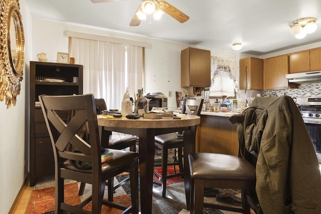 dining area featuring a ceiling fan