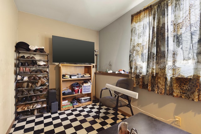 living area with tile patterned floors