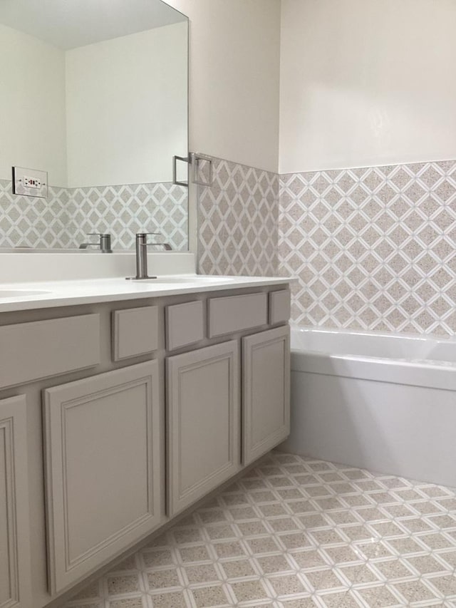 bathroom with vanity and a bathing tub