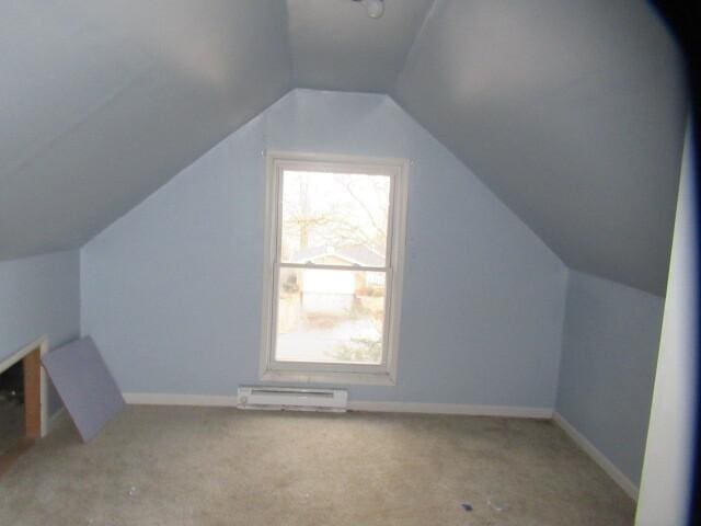 bonus room with carpet floors, a baseboard radiator, lofted ceiling, and baseboards