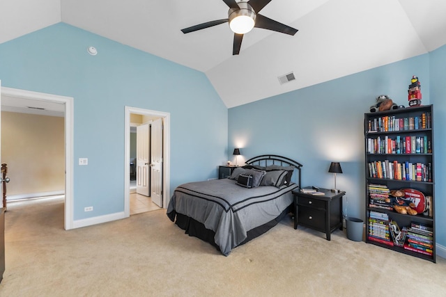 carpeted bedroom featuring lofted ceiling, baseboards, visible vents, and ceiling fan