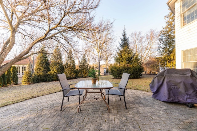 view of patio / terrace featuring outdoor dining space and a grill