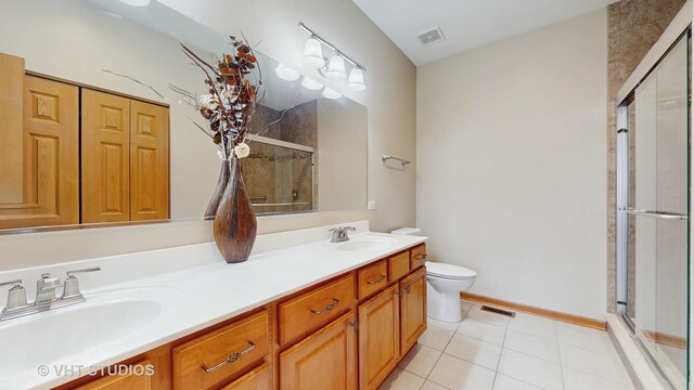 bathroom featuring a sink, visible vents, and a shower stall