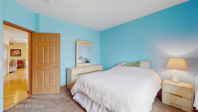 bedroom with carpet floors and visible vents