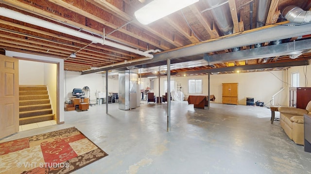 basement featuring stairway and a sink